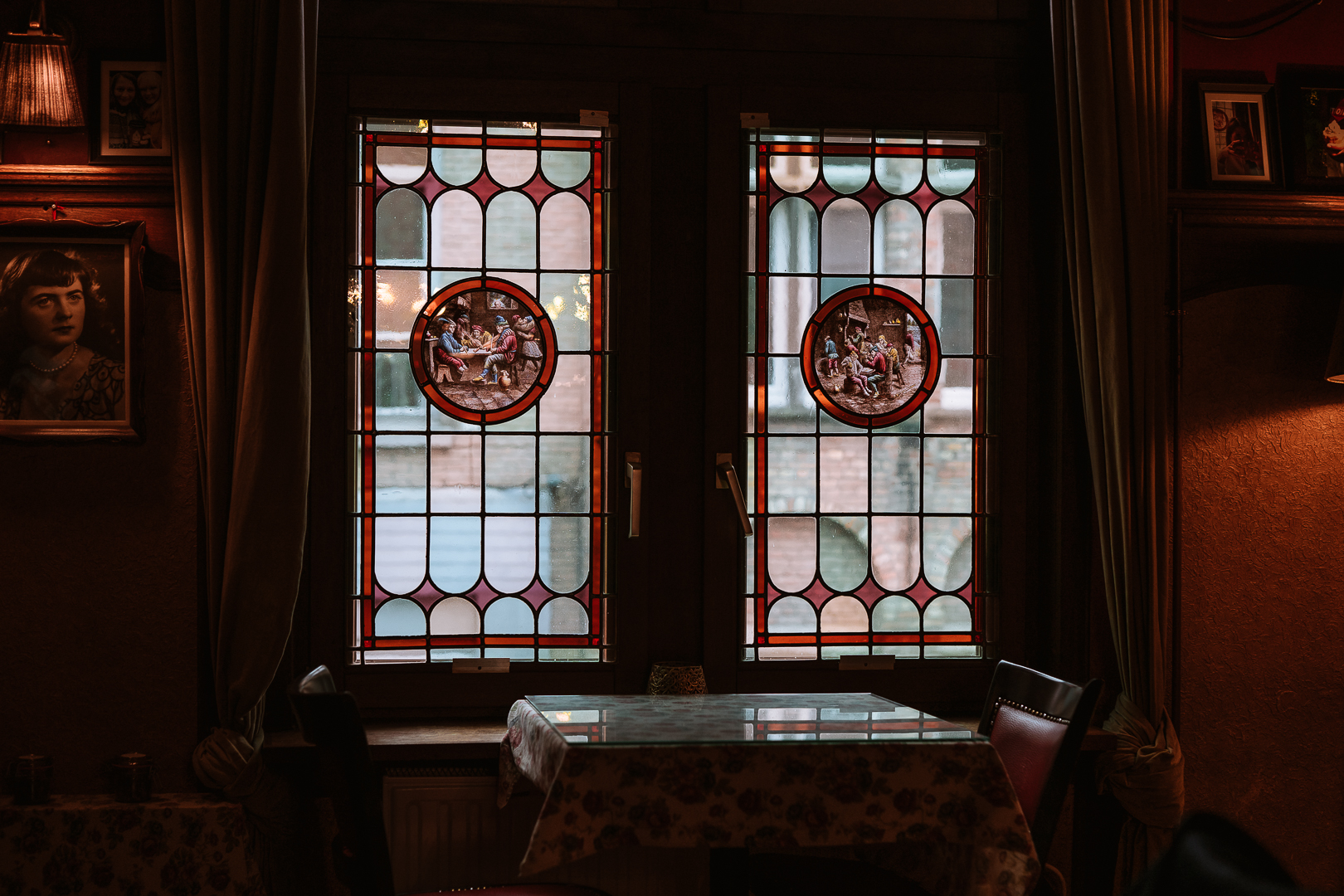 old stained glass window inside a tea room