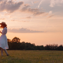 Girl dancing against the sunset