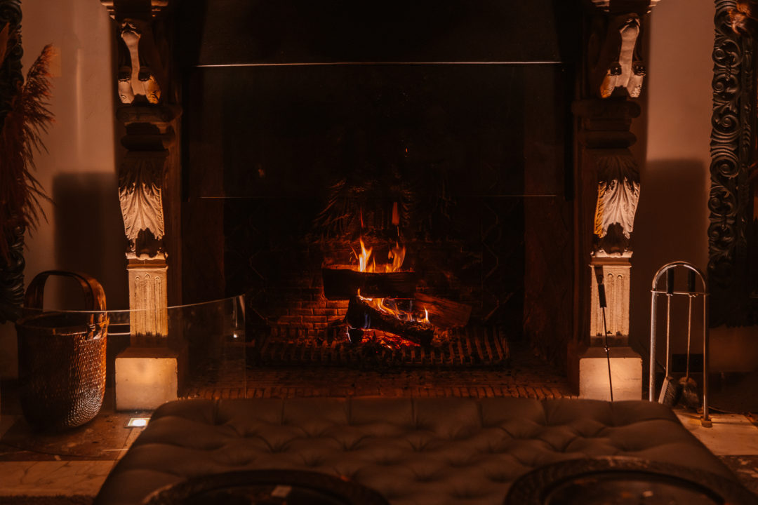 cozy fireplace at manoir de lébioles