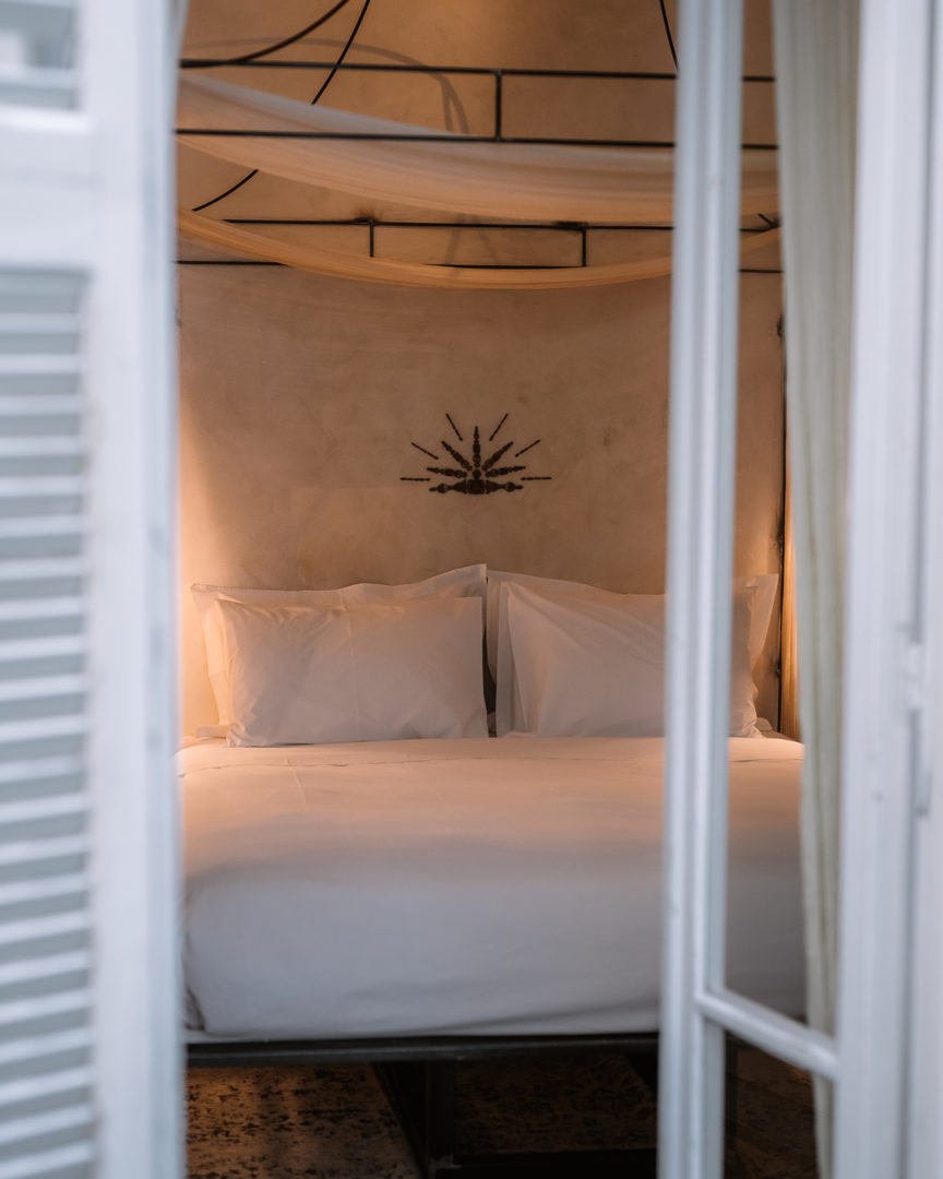 open terrace door onto a four poster bed at shila athens