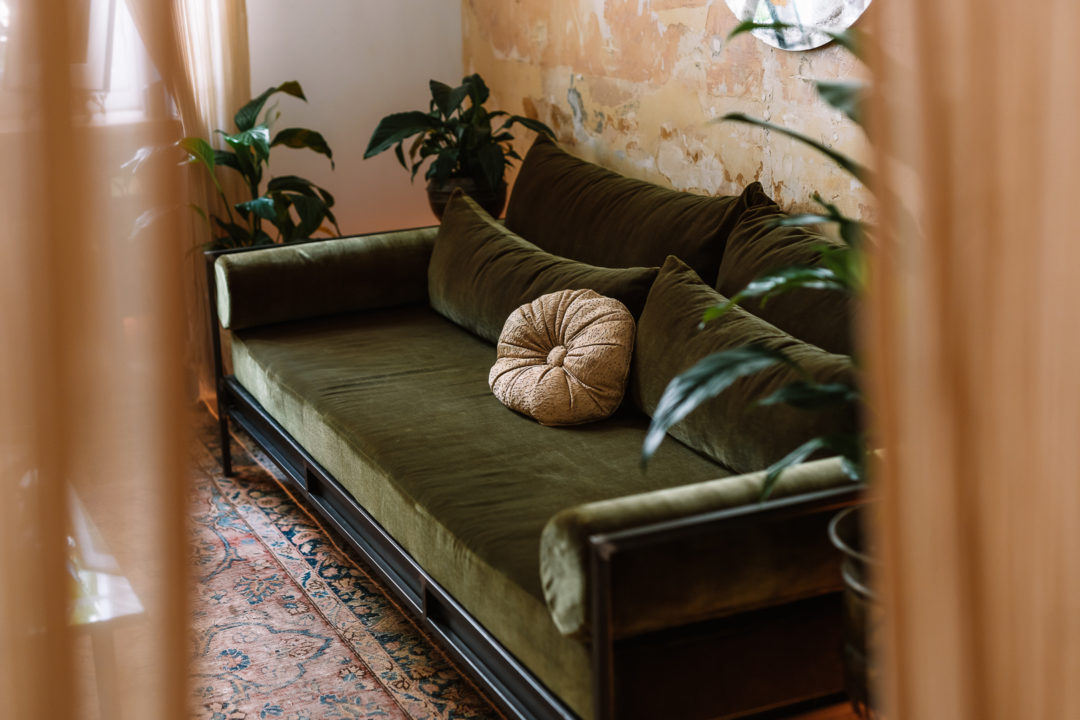 green velvet sofa at shila athens hotel library