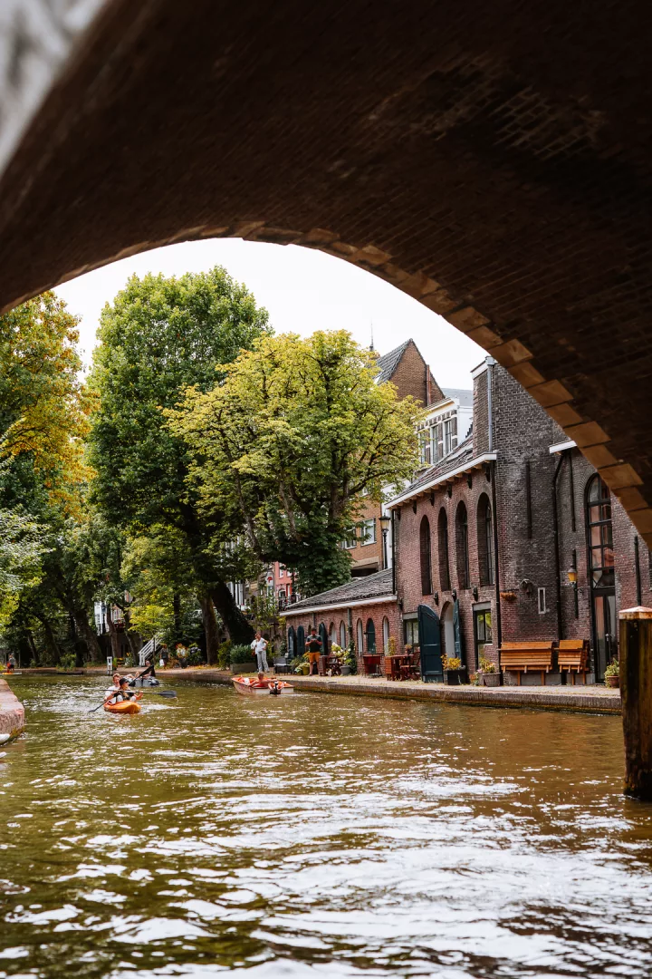 people paddling in the canals of utrecht