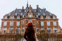woman in front of château de namur