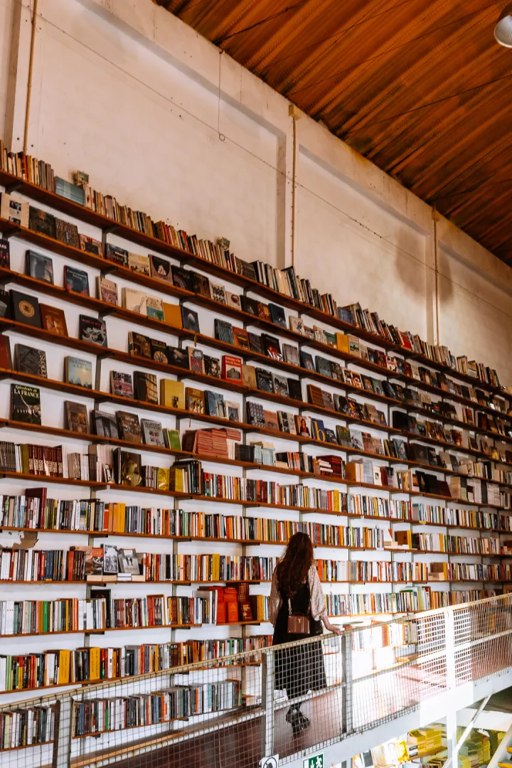 woman at ler devagar bookstore in lisbon