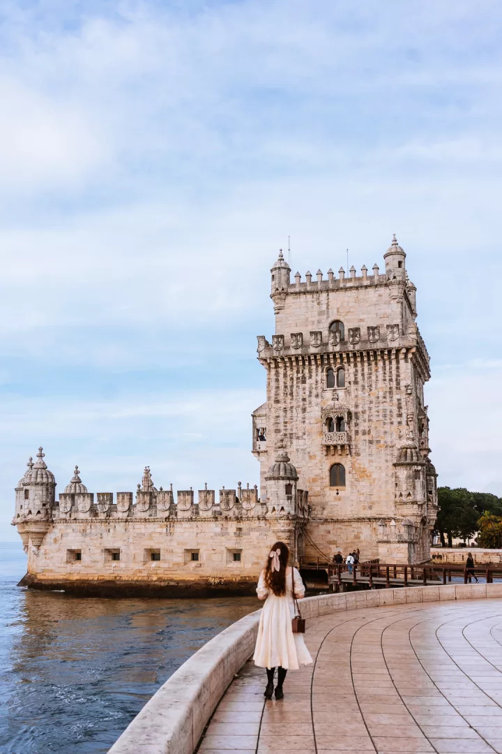 woman in front of  tower belem in lisbon