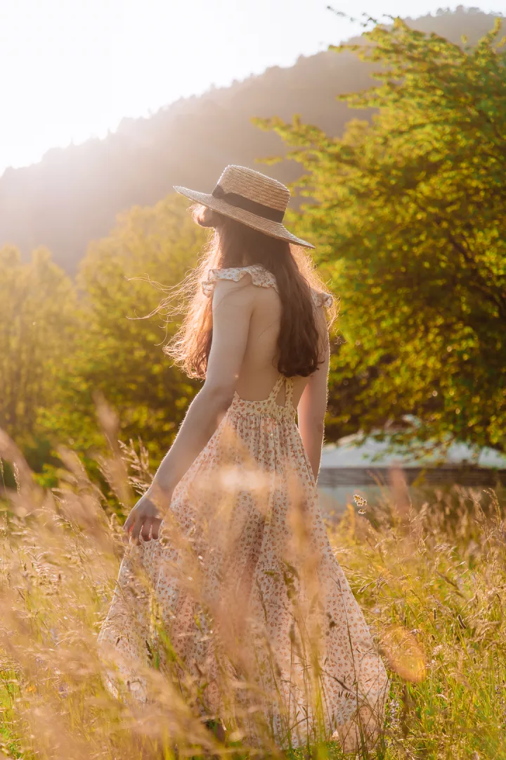 woman in dress in a golden field