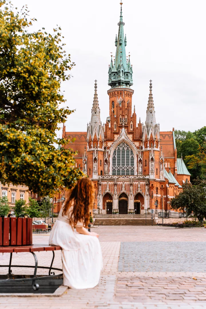 woman in front of st joseph church in krakow